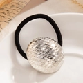 Hair tie with silver hemispherical metallic pendant featuring scale texture design - Scale Texture Disc Silver (0096)