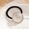 Elastic hair tie featuring a large silver geometric textured round metal pendant - Grid Texture Disc Silver (0097)