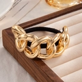 Zwart elastisch haarelastiekje met een grove goudkleurige schakel van legering - Grove Ketting (0102) / Goud