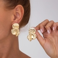Detail of large abstract gold flower earrings with a polished metallic wavy texture - 3593 Wrinkled Flower / Gold