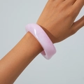 Close-up of pink translucent acrylic bangle with artistic marbled stone texture - Deep Pink