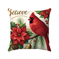 Detail showing red cardinal and poinsettia print with Believe text on pillow cover - Believe and Cardinal Pattern
