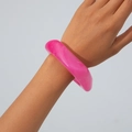 Detailed close-up of a translucent hot pink marble resin chunky bangle on a wrist - Rose Red