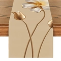 Linen table runner featuring elegant white and gold floral patterns on a wooden table - Gold Relief Floral