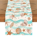 Close-up of linen table runner with ocean starfish and seashell patterns on wood - Marine Life Water Ripple