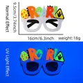 White felt dinosaur party glasses showing normal and UV light glow-in-the-dark effects - Roar Egg Style (Dinosaur Party Glasses)