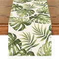 Linen table runner with green tropical palm leaves on a rustic wooden table - Tropical Rainforest Leaves