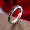 Elegant silver ring featuring emerald green cubic zirconia in a sleek channel setting - May Birthstone