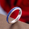 Silver-tone eternity ring with circular blue stones and polished titanium steel finish - September Birthstone