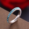 Eternity ring in silver finish with light blue crystals and micro-pave setting - December Birthstone