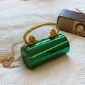 Emerald green cylindrical acrylic evening clutch with gold lion head handle and chain strap - Green