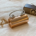 Rose gold cylindrical acrylic evening clutch with lion head accents and silver ring handle - Rose Gold