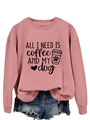 Close-up of pink crewneck sweatshirt with All I Need Is Coffee and My Dog print - Rose Gold (Black Font)