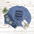 Flat lay of gray-blue sweatshirt with vintage typography paired with ripped jeans - Blue (Black Font)