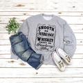 Flat lay of gray crewneck sweatshirt with Tennessee Whiskey print on wood floor - Grey (Black Font)