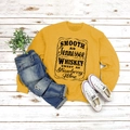 Flat lay of mustard yellow crewneck sweatshirt with vintage lettering on rustic wood floor - S / Yellow (Black Font)