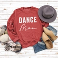 Flat lay of red Dance Mom sweatshirt with autumn accessories on white wood floor - S / Red