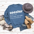 Blue crewneck sweatshirt with Seester print arranged with autumn accessories on wood - S / Blue (White Font)