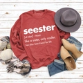 Flat lay of a burgundy crewneck sweatshirt with seester print and autumn accessories - S / Red (White Font)