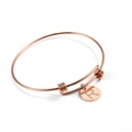 Close-up of rose gold adjustable wire bracelet with circular initial R letter charm - Rose Gold (Single Charm)