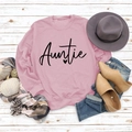 Flat lay of pink crewneck Auntie sweatshirt with autumn accessories on white wood - S / Pink Sweatshirt (Black Font)