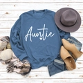 Flat lay of blue Auntie sweatshirt with autumn accessories on white wooden background - S / Blue Sweatshirt (White Font)