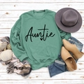 Flat lay of green crewneck Auntie sweatshirt with autumn lifestyle props on wood - S / Light Green Sweatshirt (Black Font)