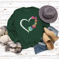 Detail of heart and rainbow paw print on dark green crewneck sweatshirt with autumn styling - S / Dark Green