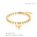 Bracciale a sfere in acciaio dorato con ciondolo rotondo e carattere cinese Fu - Bracciale Dorato (LB1098)