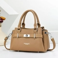 Elegant camel leather handbag with dual handles and detachable shoulder strap in studio setting - Apricot
