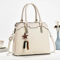 Chic woven texture crossbody bag in cream PU leather with decorative star charm - Off White