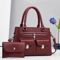 Detail of wine red pebble leather tote bag with silver hardware and matching envelope wallet - Burgundy