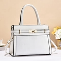Detail view of white trapezoid handbag with gold hardware and elegant top handle - Off White