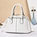 Detail of white dome handbag featuring woven texture and gold dual zippers - Off White