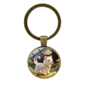 Dettaglio di un portachiavi in bronzo con illustrazione di husky e motivi di nuvole dorate - Cane (Bronzo-11)