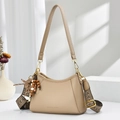 Beige pebble leather handbag with ethnic woven strap and beaded tassel detail - Khaki