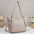 Detail of embossed lychee leather tote bag with vertical stripes and gold hardware - Off White