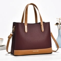 Bordeauxrode leren tote bag met contrastkleurige handvatten en verstelbare riem - Bordeauxrood