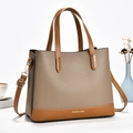 Minimalistische tweekleurige draagtas van taupe en bruin leer met mode-opdruk - Khaki
