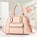 Detailed shot of pink pebble grain leather texture with gold hardware and black oil edges - Pink