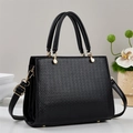 Fashionable black embossed faux leather handbag with dual top handles and gold hardware - Black