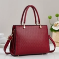 Elegant red macaron tote bag with geometric embossing and adjustable shoulder strap - Burgundy