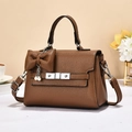 Elegant brown pebbled leather handbag for women with top handle and pearl bow charm detail - Earthy Yellow