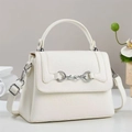Close-up of a white lychee grain leather handbag with silver horsebit buckle detail - Off White