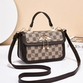 Brown checkerboard crossbody bag with golden swan clasp and pearl charms on studio background - Khaki/Coffee
