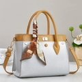 Silver textured tote bag with brown straps and a decorative floral scarf detail - Silver