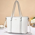 Detail view of large white tote bag with golden metal trim and adjustable shoulder strap - Off White