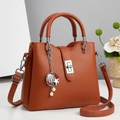 Elegante borsa a mano in pelle martellata arancio-marrone con chiusura argentata - Giallo Terra