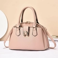 Detail of lychee textured pink tote bag featuring elegant golden horseshoe metal buckle - Pink