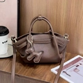 Chic dark coffee lychee pattern handbag with puppy charm and crossbody strap - Coffee